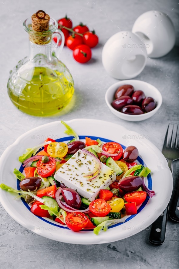 Delicious Greek salad with feta cheese, olives, tomatoes, cucumbers ...