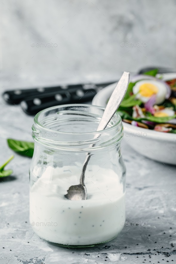 Poppy Seed Salad Dressing Sauce Ranch In A Glass With Spinach Salad In The Background Stock 5849