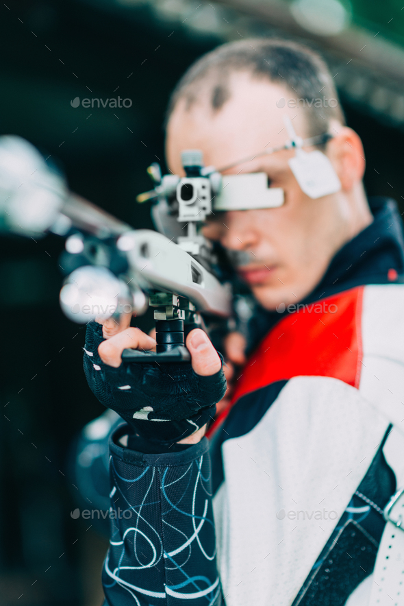 Man practicing for competition sport shooting with free rifle Stock