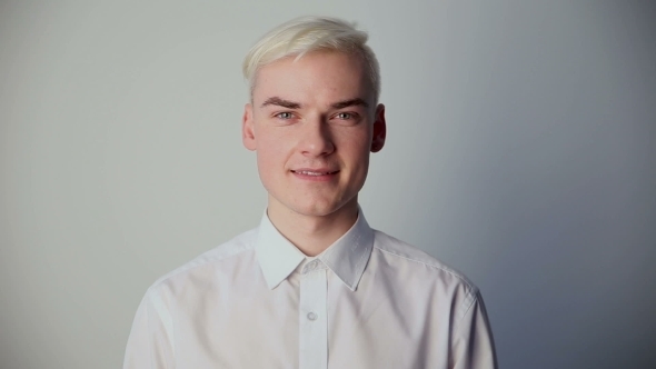 Modern Youth. the Young Guy Smiles in Front of the Camera. Concept of Success.