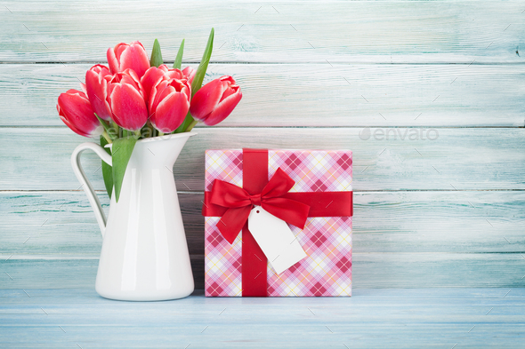 Red tulip flowers and gift box - Stock Photo - Images