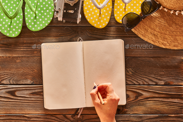 Woman planning a beach trip - Stock Photo - Images