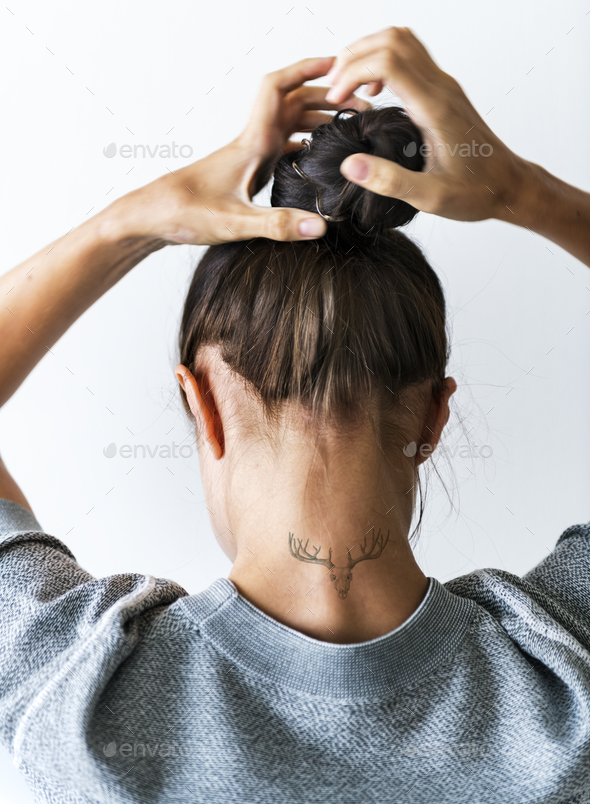 Woman putting her hair up in a bun Stock Photo by Rawpixel | PhotoDune