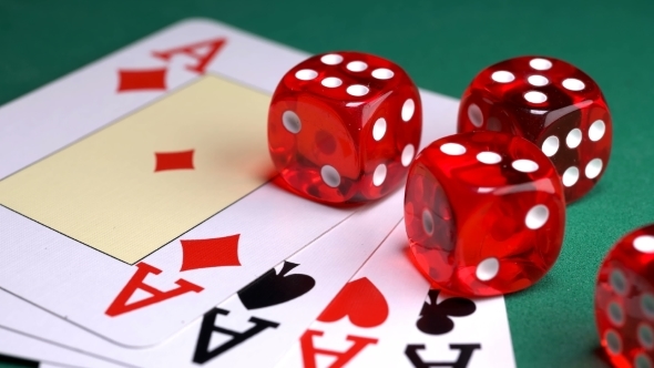 Red Dice on the Game Table with Cards and Chips to Play alt