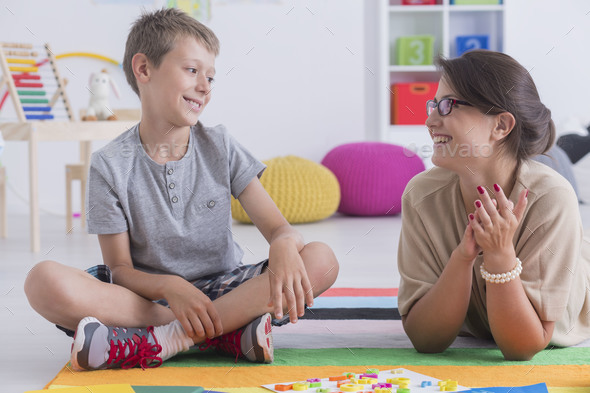 Happy child and school counselor - Stock Photo - Images