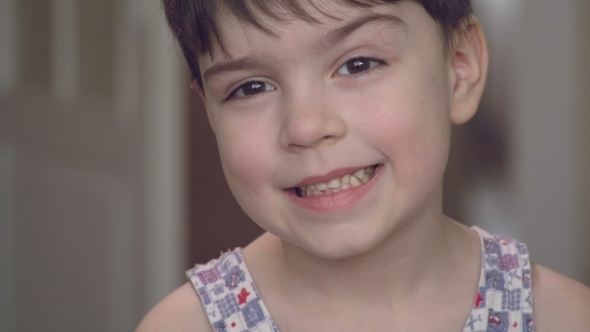 Portrait of a Cheerful Beautiful Boy with Bright Emotions  of a Camera