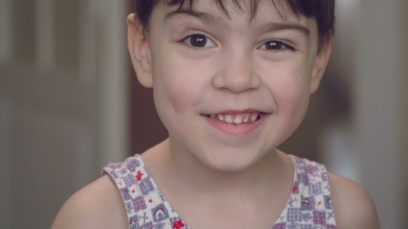 Portrait of a Cheerful Beautiful Boy with Bright Emotions  of a Camera