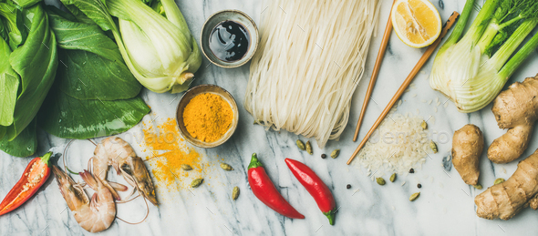 Flat-lay of Asian cuisine ingredients over grey marble background - Stock Photo - Images
