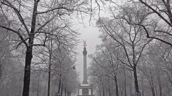 The Angel of Peace on the Top of Friedensengel Monument in Munich, Germany During the Snow Srorm alt