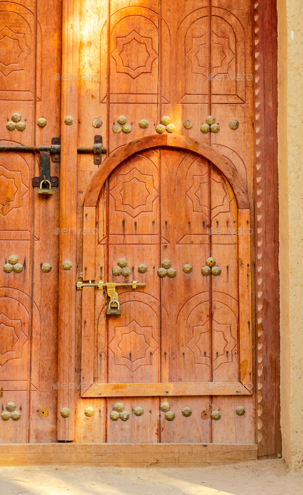 Traditional Arabian Door Within a Door Stock Photo by zambezi | PhotoDune