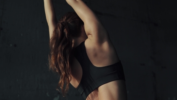 Sexy Body of a Sporty Girl . Girl Doing Stretching Sitting on a String. Gymnast for Training