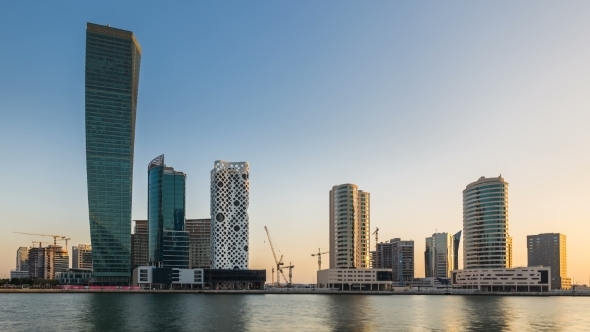 Sunset Over Embankment of Dubai Creek, Business Bay at Night. Dubai, UAE alt