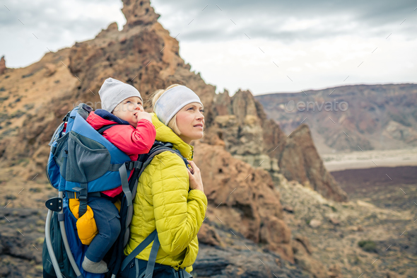 Family hike, mother with baby in backpack - Stock Photo - Images