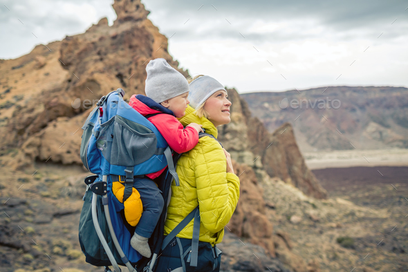Family hike, mother with baby in backpack - Stock Photo - Images