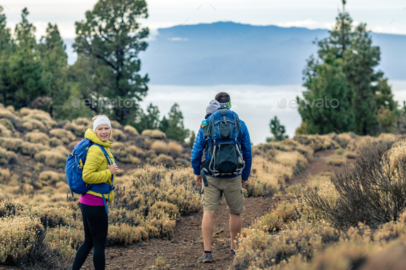 Couple hiking with baby boy travelling in backpack - Stock Photo - Images