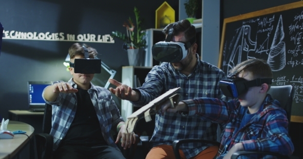 Kids Examining VR Technology in Laboratory alt