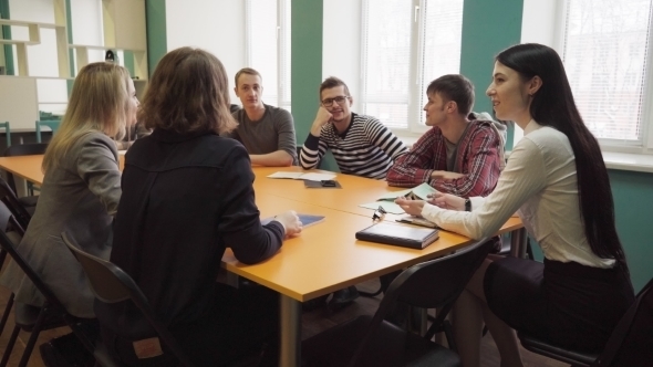 Female Teacher Talks with Students During a Lesson at University