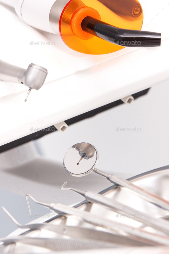 Set of dental tools and instruments used by dentists in stomatology office Stock Photo by ratmaner
