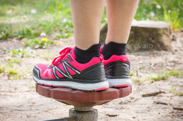 Legs of elderly senior woman on outdoor gym, healthy lifestyle concept - Stock Photo - Images