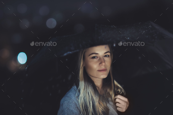 Beautiful woman at rainy night - Stock Photo - Images