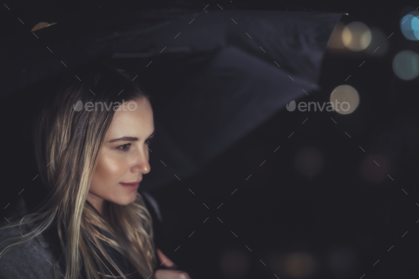 Beautiful woman at rainy night - Stock Photo - Images