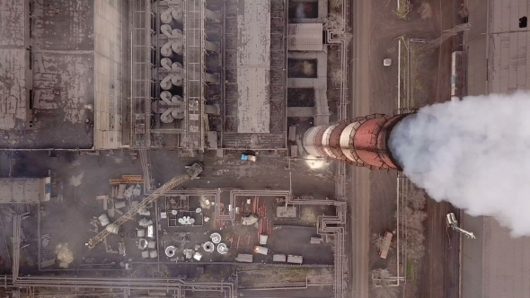 Aerial View Emission To Atmosphere From Industrial Pipes Smokestack Pipes Shooted with Drone alt