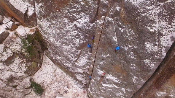 Climbers on the Wall Training Climbers on a High Rock in a Siberian Nature Reserve Stolby alt
