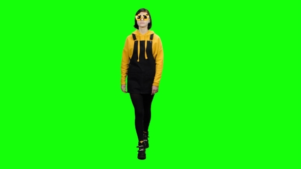 Teenager Goes in Funny Glasses and Fools Around Green Screen alt