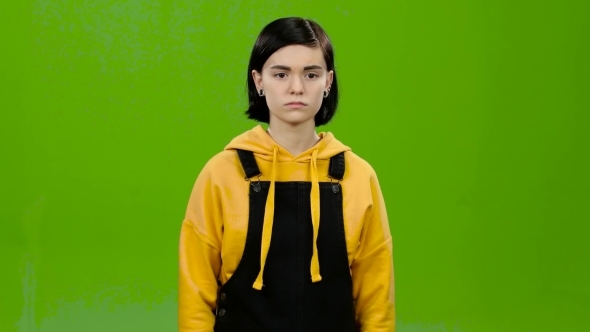 Teen Looks at a Credit Card and Points at It alt