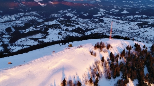 Flying Over Communications Tower, Mountain Snow Covered Winter Landscape alt