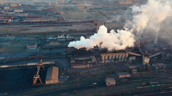 Emission To Atmosphere From Industrial Pipes Smokestack Pipes Shooted with Drone Aerial View alt