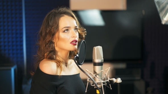 Beautiful Sexy Young Woman Singing. Female Vocal. Professional Recording Studio. alt
