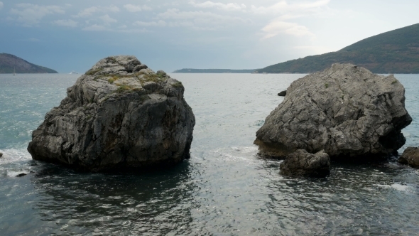 Waves Beating on the Rocks on the Beach in Montenegro alt