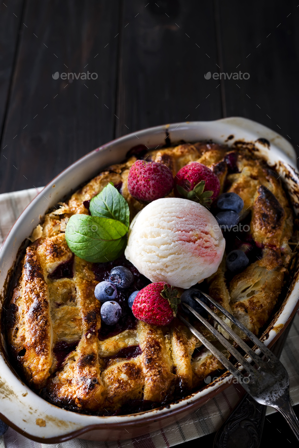 Berry Tart. Delicious cberry tart with ice cream, frozen strawberry and blueberries - Stock Photo - Images