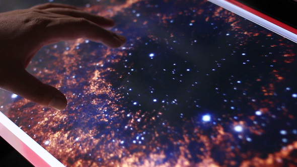 Illustration Of The Deep Space Galaxies On Touch Screen Computer