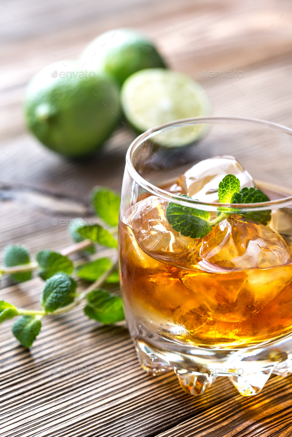 Glass of rum on the wooden background Stock Photo by Alex9500 | PhotoDune