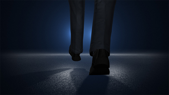 Businessman Walking On a Road To The Car Lights