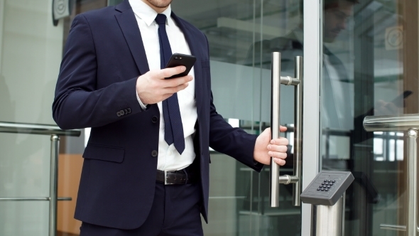 Portrait of Confident Businessman in Modern Office. alt