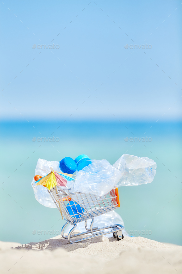 Miniature shopping cart with empty plastic bottles. - Stock Photo - Images
