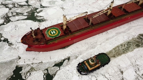 The Ship Sails Through the Sea Ice in the Winter alt