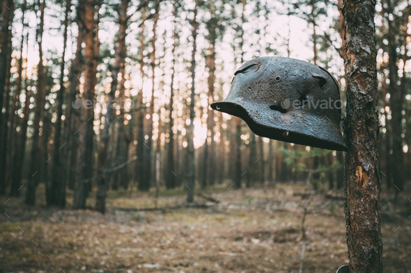 Damaged By Bullets And Shrapnel Metal Helmet Of German Infantry - Stock Photo - Images