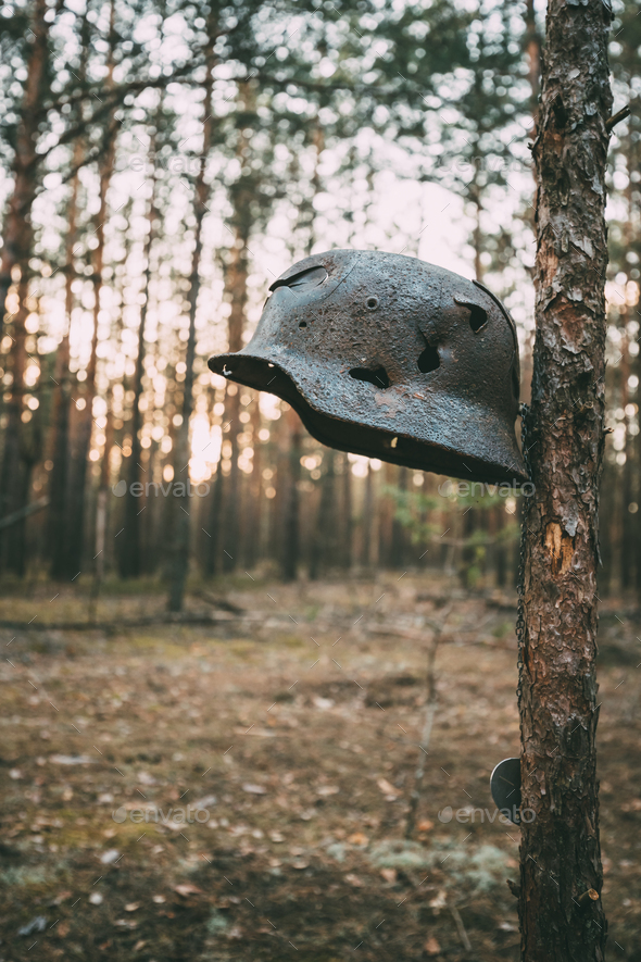 Damaged By Bullets And Shrapnel Metal Helmet Of German Infantry - Stock Photo - Images