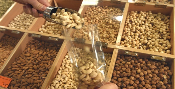 Peeled Nuts and Seeds in Boxes. alt