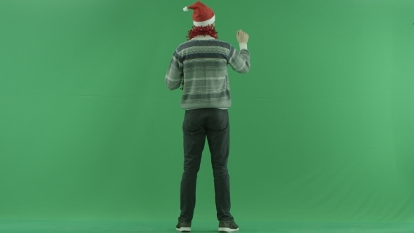 Young Bearded Man Using Virtual Touchscreen in Augmented Reality, Green Chroma Key Background