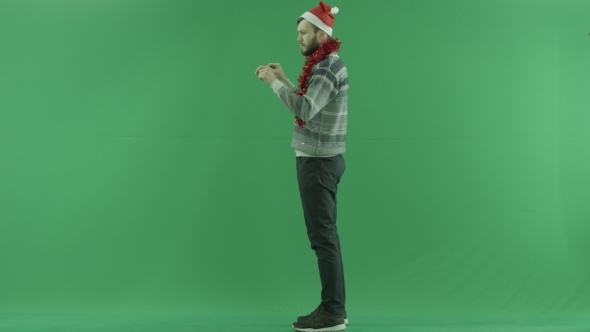 Young Bearded Man in Virtual Reality Touches Screen, Green Chroma Key Background