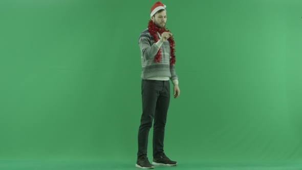Young Bearded Man Touches Virtual Screen in Augmented Reality, Green Chroma Key Background
