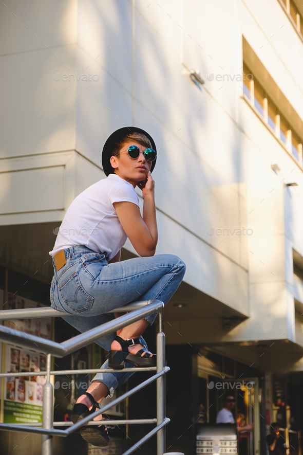 Modern woman portrait wearing stylish round glasses hanging out - Stock Photo - Images