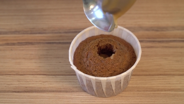 Patisserie Dessert - Cake. the Confectioner Fills a Caramel Hole