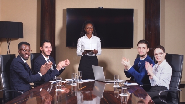 Young Team Applause in Meeting During Successful Presentation. alt