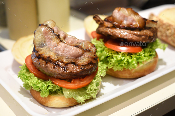 Preparing a hamburger in a restaurant - Stock Photo - Images